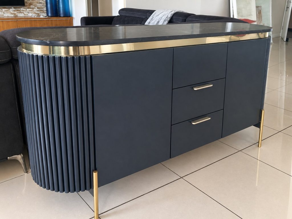 Navy fluted credenza with brass trim