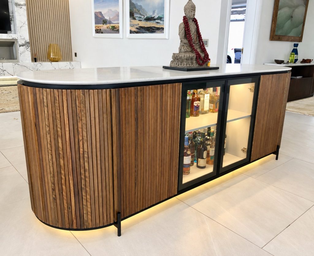 Curved fluted bar with integrated lighting